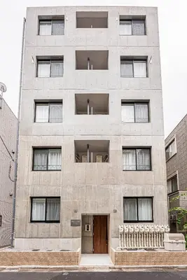 an old stone building with a door and windows at New-built APT at Asakusa-Skytree area with Tranquil block in Tokyo