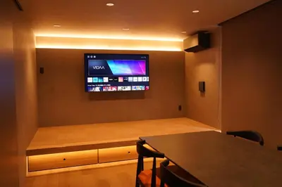 a room with a flat screen tv on a wall at Musashi Condo Takadanobaba in Tokyo