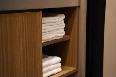 a stack of towels in a closet at Musashi Condo Takadanobaba in Tokyo