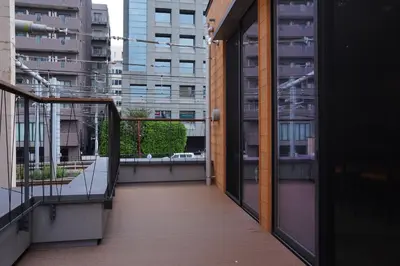 a balcony with a view of a city at Musashi Condo Takadanobaba in Tokyo