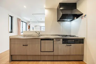 a kitchen with a sink and a stove at Four Trees Stay Yotsugi Skytree View in Tokyo