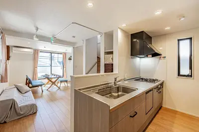 a kitchen with a sink and a stove at Four Trees Stay Yotsugi Skytree View in Tokyo