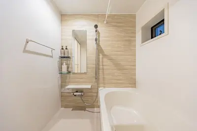 a bathroom with a bath tub and a sink at Four Trees Stay Yotsugi Skytree View in Tokyo