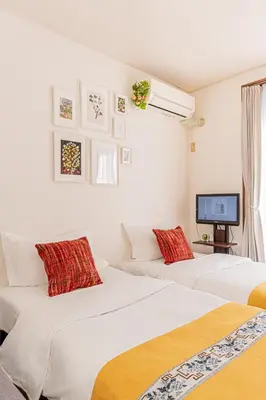 two white beds in a room with a tv at Happy House NIshi-Koiwa Keisei Koiwa Station 5min in Tokyo