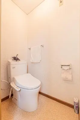 a bathroom with a toilet and towels on the wall at Happy House NIshi-Koiwa Keisei Koiwa Station 5min in Tokyo