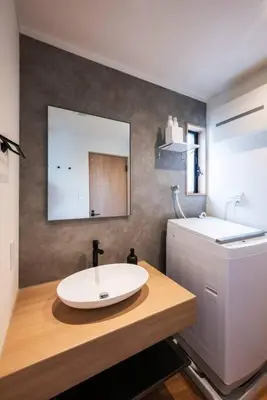 a bathroom with a sink and a mirror on a counter at Casa Stella Tokyo #3 Higashi Shinjuku in Tokyo