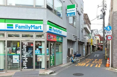 a street with a familymart store on the side of a building at Hotel SHIBA INU in Tokyo