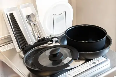 a pan and a bowl on top of a table at Hotel SHIBA INU in Tokyo