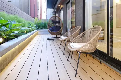 a row of chairs on a balcony with plants at \u4f59\u82b1\u91ccSakura Tokyo\u68ee\u4e0b in Tokyo
