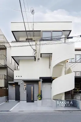 a white building with a staircase in front of it at \u4f59\u82b1\u91ccSakura Tokyo\u68ee\u4e0b in Tokyo