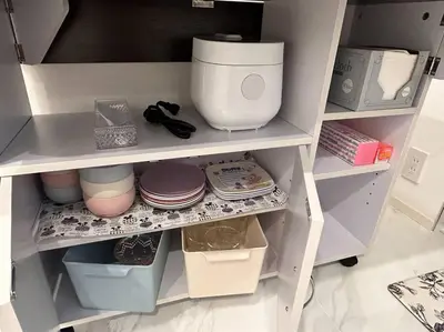 a white kitchen shelf with food items on it at residence MINAMI-AOYAMA102 in Tokyo