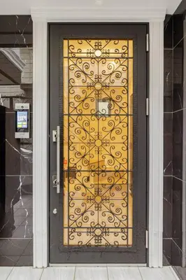 a door with a golden gate on a building at residence MINAMI-AOYAMA102 in Tokyo