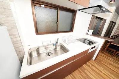 a kitchen with a stainless steel sink in a room at ACTResidence\u7b2c\u4e8c 4\u5ba41\u30d0\u30b9\u30eb\u30fc\u30e01\u30b7\u30e3\u30ef\u30fc3\u30c8\u30a4\u30ec in Tokyo