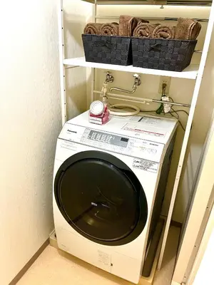 a washer and dryer in a room at Nr Ikebukuro! Room size 45m2! Free unlimited Wi-Fi! in Tokyo