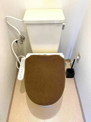 a toilet in a bathroom with a remote control at Nr Ikebukuro! Room size 45m2! Free unlimited Wi-Fi! in Tokyo