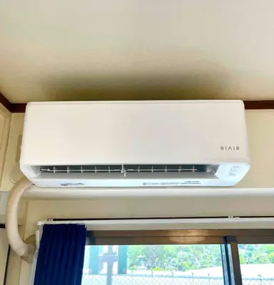 a white air conditioner sitting on top of a ceiling at Nr Ikebukuro! Room size 45m2! Free unlimited Wi-Fi! in Tokyo