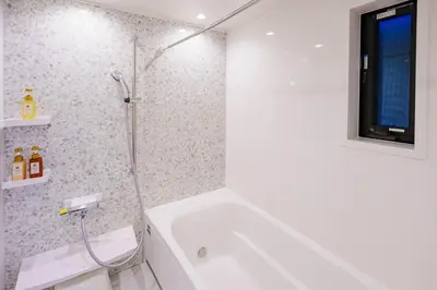 a bathroom with a shower and a white tub at GH5286 Eight minutes to Akihabara Complete facilities and convenient location in Tokyo