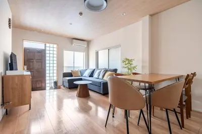 a living room with a couch and a table at \u30a2\u30f3\u30c9\u30b9\u30c6\u30a4\u5927\u68ee\u897f2\u4e01\u76ee in Tokyo