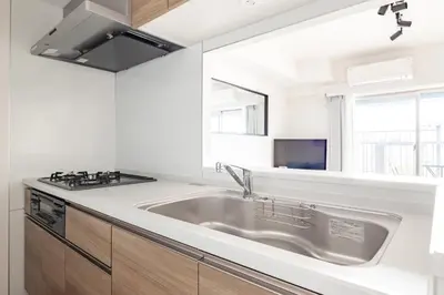 a kitchen with a sink and a stove at Dash Living Asakusa East in Tokyo