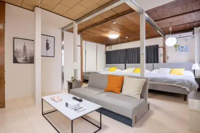 a living room with a couch and a bed at 2F - Vacation STAY 51571v in Tokyo