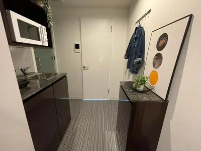 a bathroom with a sink and a counter top at COMMA HOUSE Shinjuku 303 in Tokyo