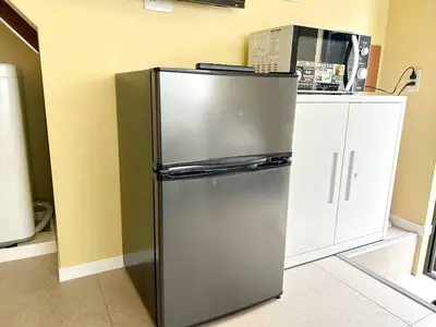 a stainless steel refrigerator in a kitchen at \u30a2\u30f3\u30c9\u30b9\u30c6\u30a4\u6e0b\u8c37\u672c\u753a5\u4e01\u76ee1f in Tokyo