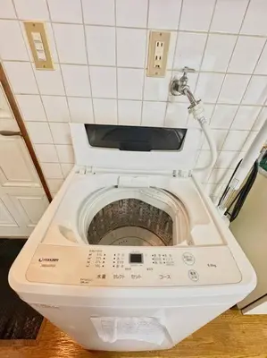 a white toilet with the seat up in a bathroom at \u30a2\u30f3\u30c9\u30b9\u30c6\u30a4\u6e0b\u8c37\u672c\u753a5\u4e01\u76ee2f in Tokyo