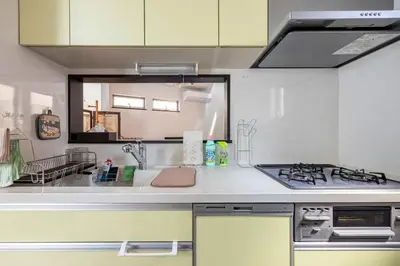 a kitchen with a sink and a stove at \u30a2\u30f3\u30c9\u30b9\u30c6\u30a4\u6771\u5411\u5cf61\u4e01\u76ee in Tokyo