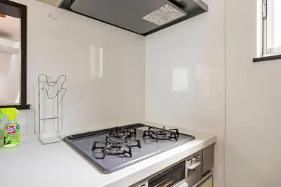 a kitchen with a stove top in a kitchen at \u30a2\u30f3\u30c9\u30b9\u30c6\u30a4\u6771\u5411\u5cf61\u4e01\u76ee in Tokyo
