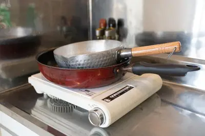 a pan sitting on top of a stove at Royal Palace in Tokyo
