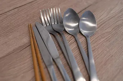 a group of silver utensils sitting on top of a table at Royal Palace in Tokyo