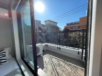 a balcony with a view of a city at COMMA HOUSE Shinjuku 401 in Tokyo