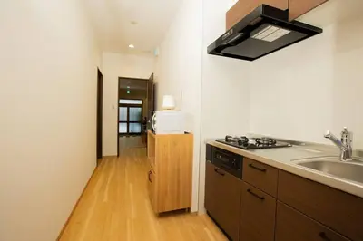 a kitchen with a sink and a counter top at \u30a2\u30f3\u30c9\u30b9\u30c6\u30a4\u6d45\u83495\u4e01\u76ee1f in Tokyo