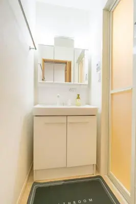 a bathroom with a sink and a mirror at Seibu Shinjuku Station 2 min walk Shin-Okubo Station 6 min walk,4 people can stay ISJ35 in Tokyo