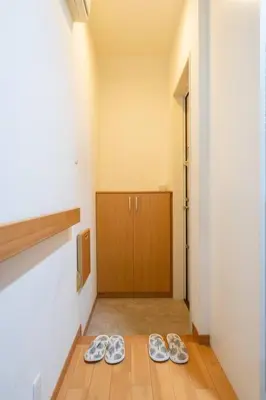 two pairs of shoes sitting on the floor in a hallway at Seibu Shinjuku Station 2 min walk Shin-Okubo Station 6 min walk,4 people can stay ISJ35 in Tokyo
