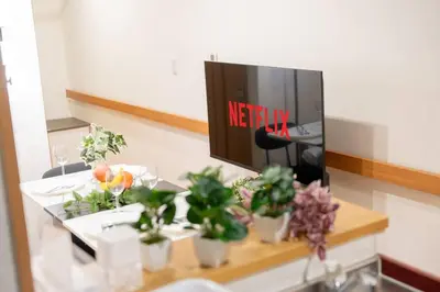 a table with potted plants and a sign in a mirror at Seibu Shinjuku Station 2 min walk Shin-Okubo Station 6 min walk,4 people can stay ISJ35 in Tokyo