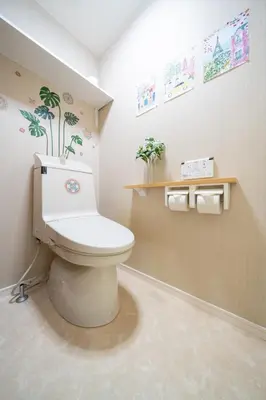a bathroom with a toilet with plants on the wall at Tokyo Shinjuku Group Stay-Up to 16 Guests ISJ36 in Tokyo