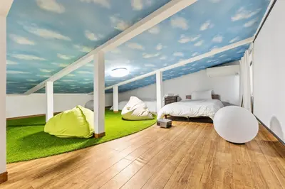 a bedroom with a mural of a sky at Tokyo Shinjuku Group Stay-Up to 16 Guests ISJ36 in Tokyo