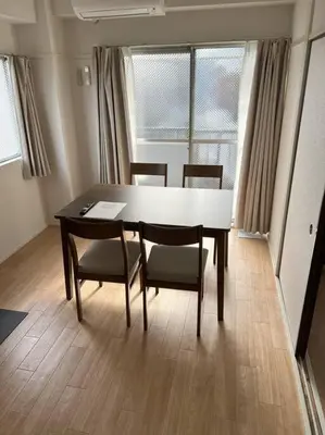 a dining room table and chairs in a room at G&R House301 in Tokyo