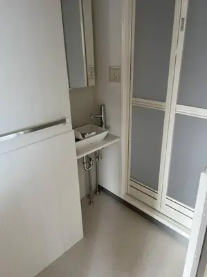 a white bathroom with a sink and a window at G&R House301 in Tokyo