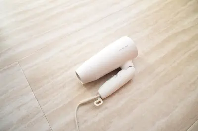 a white wii remote on a wooden floor at \u548c\u30ce\u6953cottage\u7b2c\u4e09 \u65b0\u5bbf\u306e2\u968e\u5efa\u30664\u5ba42\u30b7\u30e3\u30ef\u30fc2\u30c8\u30a4\u30ec in Tokyo