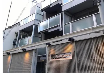 a building with a sign on the front of it at Shibuya WAVE401 SW41 in Tokyo
