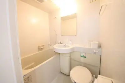 a white bathroom with a sink and a toilet at Shibuya WAVE401 SW41 in Tokyo
