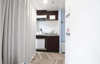 a small kitchen with a sink and a refrigerator at Shibuya WAVE401 SW41 in Tokyo
