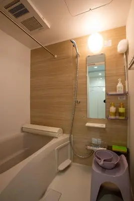 a bathroom with a shower and a tub with a toilet at \u30ed\u30fc\u30ba\u30d1\u30fc\u30af\u516b\u756a\u9928 in Tokyo