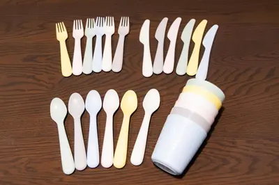 a group of plastic forks and spoons on a table at Vistalia in Tokyo
