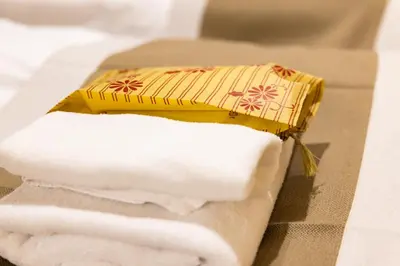 a pile of towels sitting on top of a stack of towels at Vistalia in Tokyo