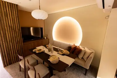 a dining room with a table and a couch at Vistalia in Tokyo