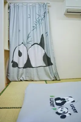 a banner with a penguin on it in a room at \u6c11\u5bbf\u521d\u661f in Tokyo