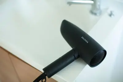 a black microphone sitting on top of a desk at NIYS apartments 55 type in Tokyo